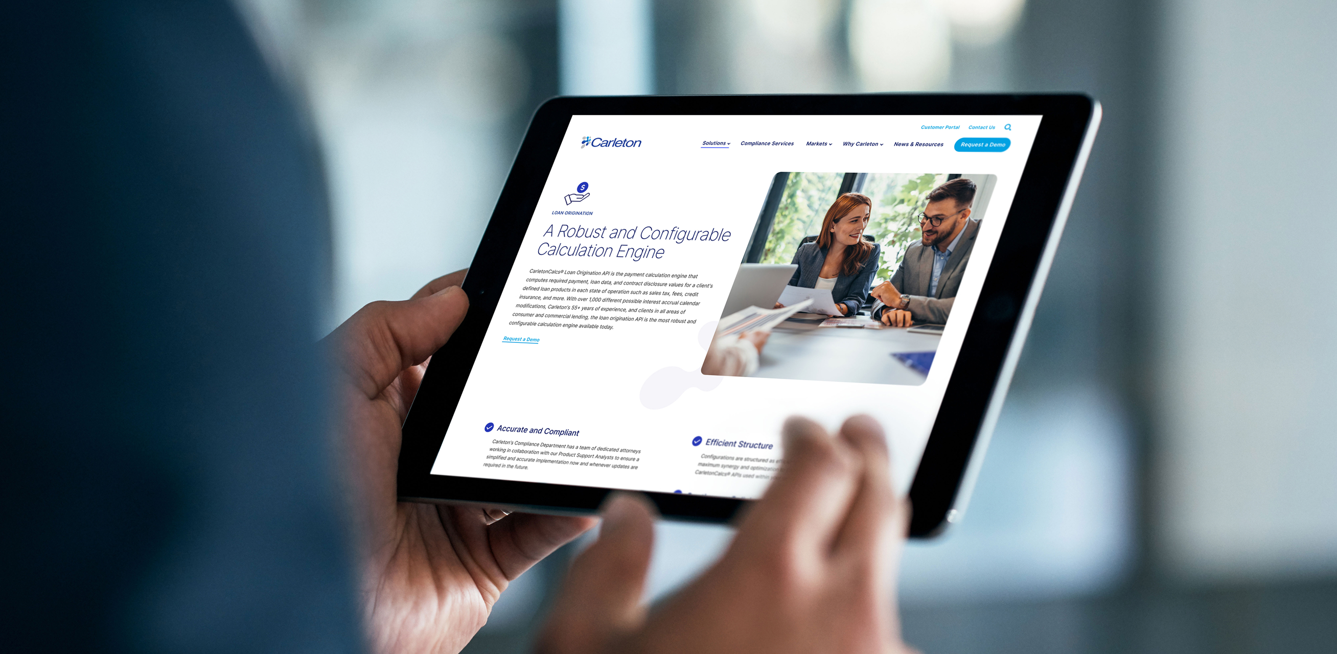 Person holding a tablet displaying the Carleton Loan Origination page