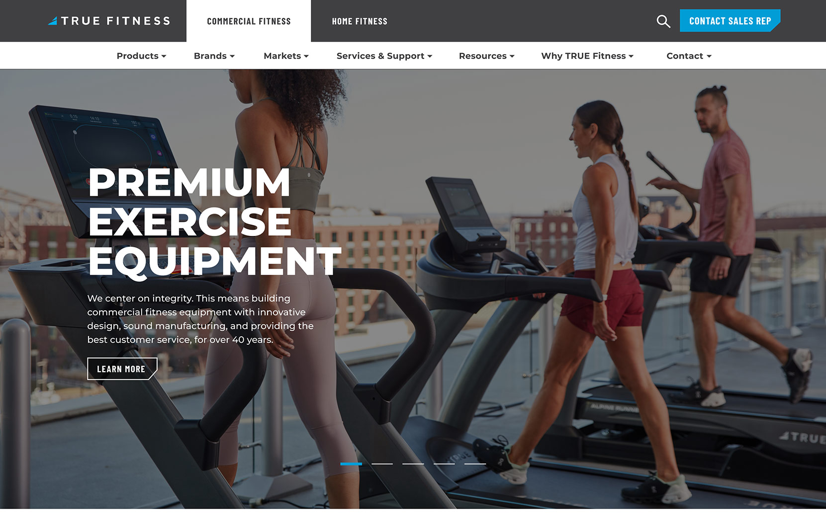 New TRUE Fitness homepage with commercial and home fitness tabs and a Premium Exercise Equipment hero.